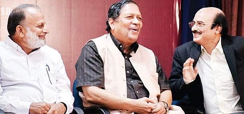Former Lokayukta Justice N Santosh Hegde (centre) interacting with Javed Jamil and Akbar Ali, at ‘Bengaluru Eid Get-Together’ programme in Bengaluru on Sunday | Pandarinath B