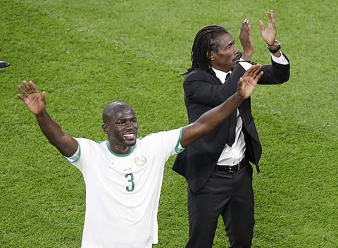 Senegal coach Aliou Cisse, right, and Senegal's Kalidou Koulibaly wave to the crowd following during the group H match between Japan and Senegal at the 2018 soccer World Cup at the Yekaterinburg Arena. | AP