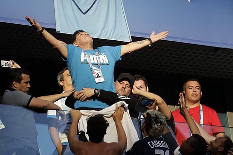 Argentina former soccer star Diego Maradona waves to the fans ahead of the group D match between Argentina and Nigeria, at the 2018 soccer World Cup in the St. Petersburg Stadium in St. Petersburg, Russia, Tuesday, June 26, 2018. | AP