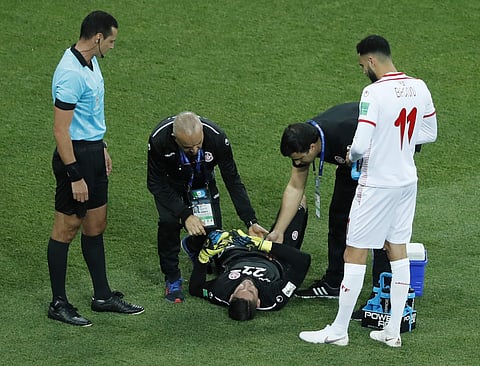 Tunisia goalkeeper Mouez Hassen is injured during the group G match between Tunisia and England at the 2018 FIFA World Cup in the Volgograd Arena in Volgograd, Russia. (AP)