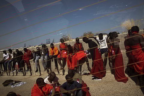 Migrants rest at the port of Algeciras, southern Spain, after being rescued in the Strait of Gibraltar, Tuesday, Jun. 26, 2018. Spain's Maritime Rescue Service says it has picked up just over 400 people from the Mediterranean as migrants hasten to reach S