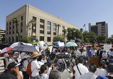 People protest immigration separation policies outside Federal Court, Tuesday, June 26, 2018, in El Paso, Texas. Cases of children and families seeking refugee were being heard inside the courthouse. | AP
