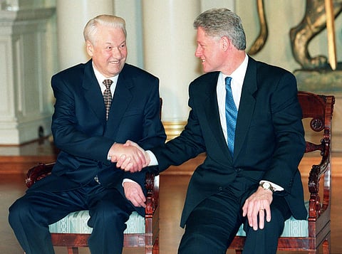 In this March 20, 1997 file photo, US President Bill Clinton, right and his Russian counterpart Boris Yeltsin shake hands as they attend the Helsinki Summit to discuss NATO expansion, at the Presidential Palace in Helsinki. Russia and the United States an