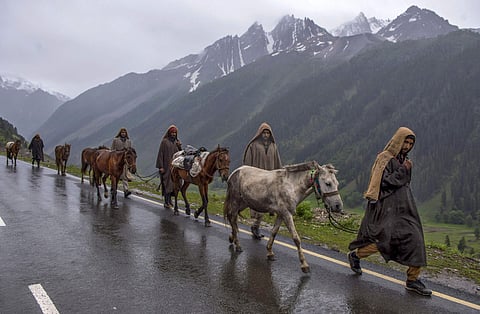 Ponywalas arrive at the base camp for Amarnath pilgrims at Baltal, in Ganderbal district of central Kashmir on Thursday, June 28, 2018. The annual two-month Amarnath Yatra set to commence on Thursday was halted dur to bad weather and heavy rainfall. (Phot