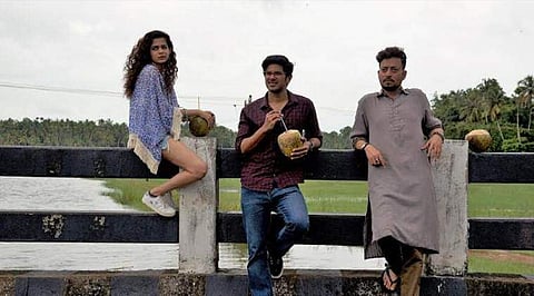 (L-R) Mithila Palkar, Dulquer Salmaan and Irrfan Khan in the poster of 'Karwaan'.