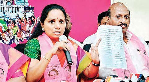 MP Kavitha shows the letter written by TRS leaders to CM regarding the alleged anti-party activities of D Srinivas, in Nizamabad on Wednesday | Express