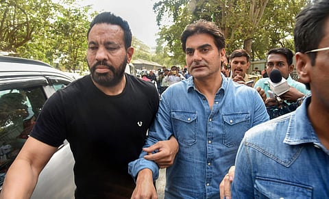 Arbaaz Khan with his brother Salman Khan's bodyguard Shera (on left) being taken to the Thane police station in connection with the IPL betting case on June 2, 2018 (PTI Photo)