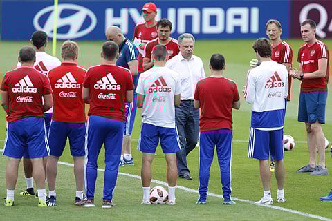 Russian Deputy Prime Minister Vitaly Mutko, center, speaks with the Russia players during Russia's official training ahead of the round of 16 match between Russia and Spain at the 2018 FIFA World Cup at the Federal Sports Centre Novogorsk, near Moscow, Ru