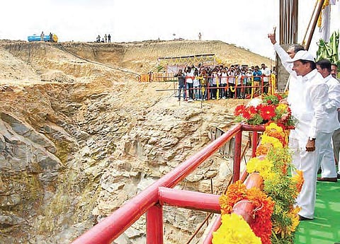 Chief Minister K Chandrasekhar Rao shows victory sign after laying foundation stone for Gattu Lift Irrigation project in Jogulamba Gadwal district on Friday | Express photo
