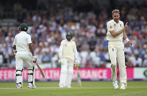 England's Stuart Broad celebrates after taking the wicket of Pakistan's Hasan Ali on day three of the second test match at Headingley, Leeds, England. (AP)