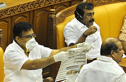 MLA Parakkal Abdulla, wearing a mask and gloves, attending the Assembly sitting on June 4, 2018. (Express Photo)