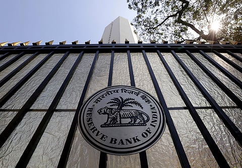 The Reserve Bank of India seal is pictured on a gate outside the RBI headquarters in Mumbai. (File Photo | Reuters)