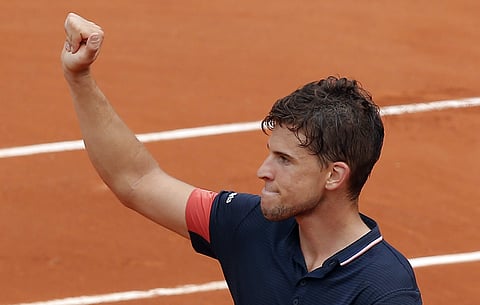 Austria's Dominic Thiem thumbs up after defeating Germany's Alexander Zverev in their quarterfinal match of the French Open tennis tournament. | AP