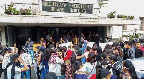 People from different parts of the city stage a protest at Meghalaya Secretariat during curfew, in Shillong on Monday | pti