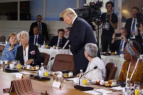 President Donald Trump arrives for a Gender Equality Advisory Council breakfast during the G-7 summit. | AP