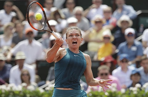 Romania's Simona Halep plays a shot against Sloane Stephens of the U.S. in the final match of the French Open tennis tournament. | AP