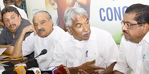 In this file photo, then former CM Oommen Chandy and ex-KPCC president V M Sudheeran seen engaged in a serious conversation, ahead of the release of the UDF assembly poll manifesto.Kerala Congress leader K M Mani is also seen. | EPS