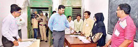 Kalaburagi Deputy Commissioner and Assistant Election Officer R Venkateshkumar at a polling booth in Kalaburagi on Friday