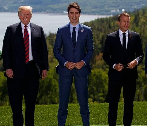 President Donald Trump, Canadian Prime Minister Justin Trudeau, and French President Emmanuel Macron (Photo | AP)