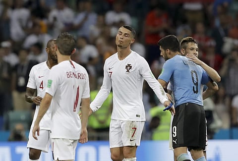 Portugal's Cristiano Ronaldo, center, reacts after the round of 16 match between Uruguay and Portugal at the 2018 soccer World Cup at the Fisht Stadium in Sochi, Russia, Saturday, June 30, 2018. | AP