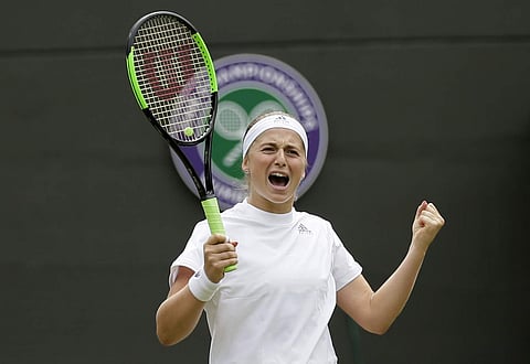 Jelena Ostapenko of Latvia celebrates defeating Dominika Cibulkova of Slovakia in their women's quarterfinal match at the Wimbledon Tennis Championships in London. (Photo | AP)