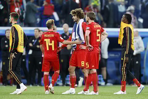 Belgium national soccer team players stand on the pitch at the end of the semifinal match between France and Belgium at the 2018 soccer World Cup in the St. Petersburg Stadium, in St. Petersburg, Russia, Tuesday, July 10, 2018. | AP