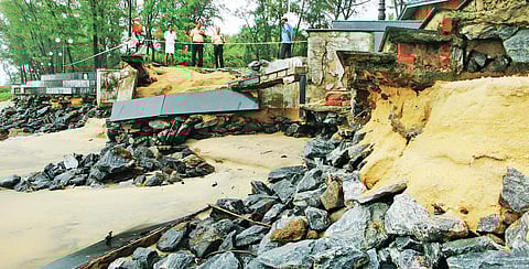 A compound wall built close to the sea destroyed in the heavy rain that lashed Kozhikode district during the past couple of days. A scene from Kappad beach | T P Sooraj