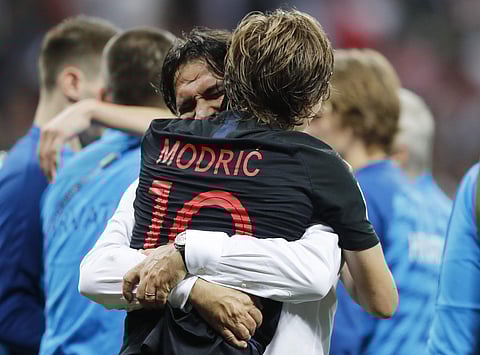 Croatia's Luka Modric celebrates with head coach Zlatko Dalic after advancing to the final during the semifinal match between Croatia and England at the 2018 soccer World Cup in the Luzhniki Stadium in Moscow, Russia, Wednesday, July 11, 2018. | AP