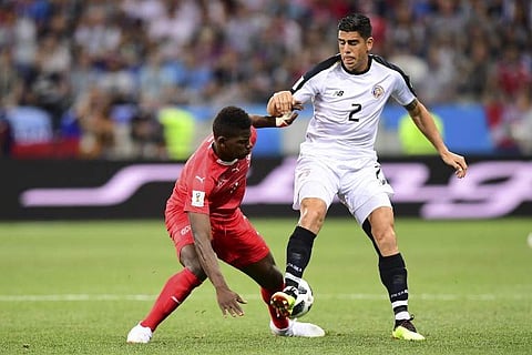 Switzerland's forward Breel Embolo (L) vies for the ball with Costa Rica's defender Johnny Acosta during the Russia 2018 World Cup Group E football match. | AFP File Photo