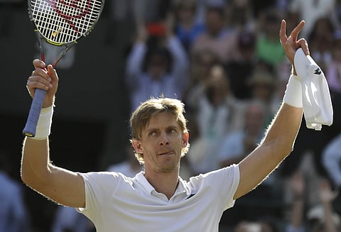 Kevin Anderson of South Africa celebrates winning his men's quarterfinals match against Switzerland's Roger Federer, at the Wimbledon Tennis Championships, in London, Wednesday July 11, 2018. | AP