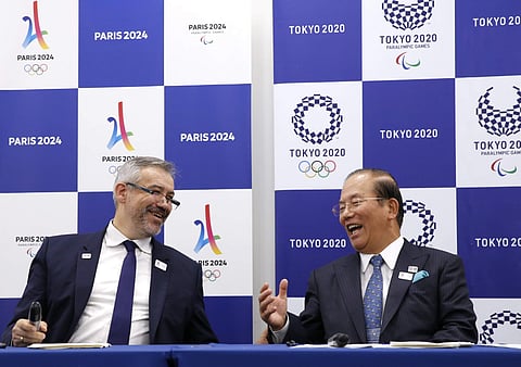 Etienne Thobois, left, Paris 2024 director general and Toshiro Muto Tokyo 2020 CEO attend the signing ceremony of the memorandum of understanding on the relations and cooperation between the two organizing committees in Tokyo. (Photo | AP)