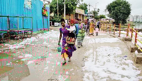 Toxic foam overflowing on to the road near Bon Cheruvu at Bowenpally in Hyderabad on Thursday | (S Senbagapandiyan | EPS)