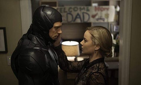 Joel Kinnaman and Abby Cornish in 'Robocop.' | AP