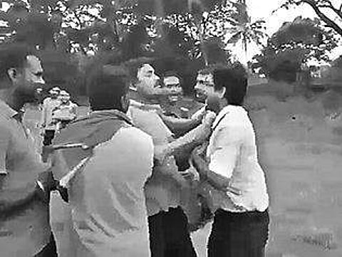 Video grab of villagers assaulting the school headmaster | Express