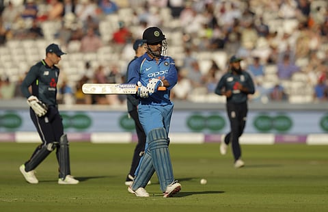 India wicketkeeper M.S. Dhoni walks off the field of play after losing his wicket from the bowling of England's Liam Plunkett during the second ODI between England and India at Lord's cricket ground in London, Saturday, July 14, 2018. | AP