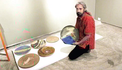 Aniruddh Sagar with his art works (Photo | EPS)