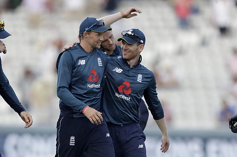 England's Joe Root, left, and England captain Eoin Morgan walk off the field of play at the end of the second ODI between England and India at Lord's cricket ground in London, Saturday, July 14, 2018. | AP
