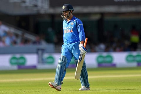MS Dhoni walks back to the pavilion after losing his wicket for 37 during the second One Day International (ODI) cricket match between England and India, at Lord's Cricket Ground in London.(Photo | AFP)