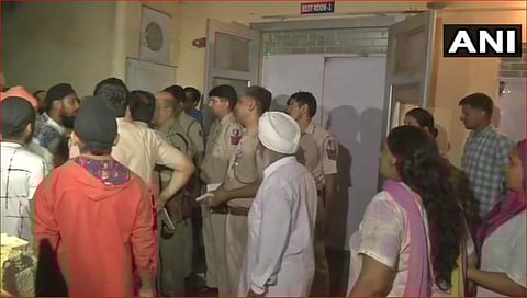 A crowd gathered at the Tilak Vihar police station in Delhi where a minor girl ended her life. (Photo | ANI)