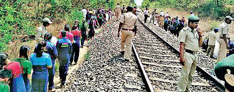 Schoolchildren and Khanapur Range forest officials during a cleanliness drive on the Londa-Miraj railway line;
