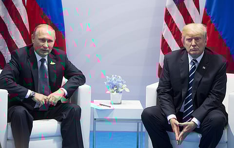US President Donald Trump and Russian President Vladimir Putin at the G20 summit in Hamburg, Germany. (Photo | AP)