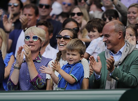 Jelena Djokovic, wife of Novak Djokovic of Serbia and their son applaud after the men's singles final match against Kevin Anderson of South Africa at the Wimbledon Tennis Championships in London. | AP