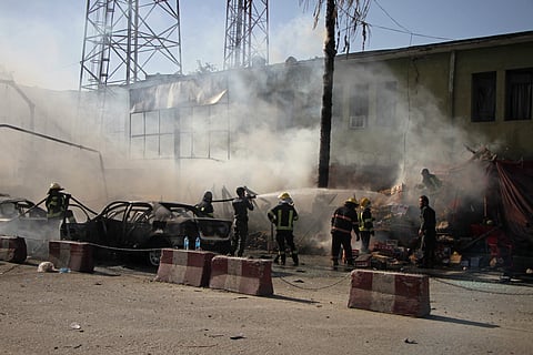 Police and firemen work at the site of a deadly suicide attack in Jalalabad, Afghanistan (File Photo | AP)