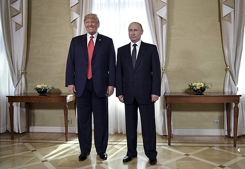 U.S. President Donald Trump and Russian President Vladimir Putin, right, pose for a photograph at the Presidential Palace in Helsinki, Finland. (Photo | AP)