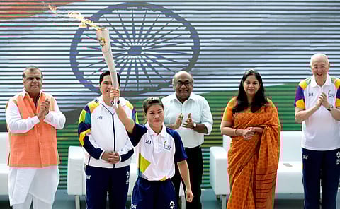 Indian boxer MC Mary Kom holds the torch as the 'Torch Relay' beigins for the 18th Asian Games Jakarta Palembang 2018 after the flame - lighting ceremony at Major Dhyanchand National Stadium in New Delhi. (Photo | PTI)