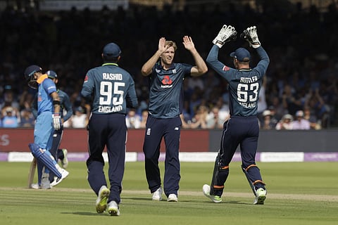 England's David Willey, center, celebrates taking the wicket of India's Shikhar Dhawan during the one day cricket match between England and India at Lord's cricket ground in London. | AP