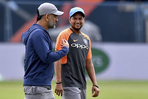 India's MS Dhoni, left, speaks with Kuldeep Yadav during a nets session at Headingley Carnegie, in Leeds, England, Monday July 16, 2018. | AP