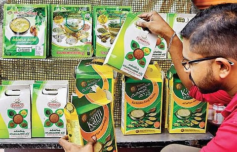 A shopkeeper arranging packets of various brands of Karkidaka kanji at a shop in the capital on Monday in view of Karkidakam month starting on Tuesday B P Deepu