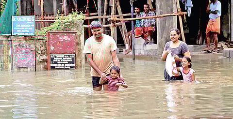 A family moves to safer place after their area was inundated in heavy rain. A scene from Chavittuvari near Kottayam | Express