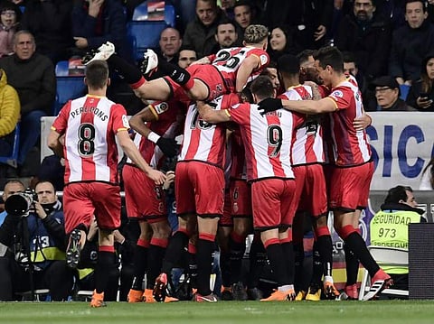 Girona players celebrate a goal during the Spanish League football match against Real Madrid. (File | AFP)